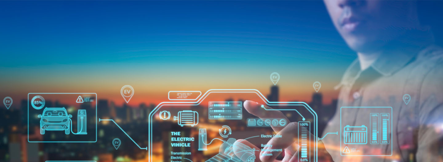 A person interacts with transparent digital interfaces displaying electric vehicle data, battery icons, and energy charts, overlaid on a blurred cityscape at sunset. The scene conveys advanced technology and smart city concepts.