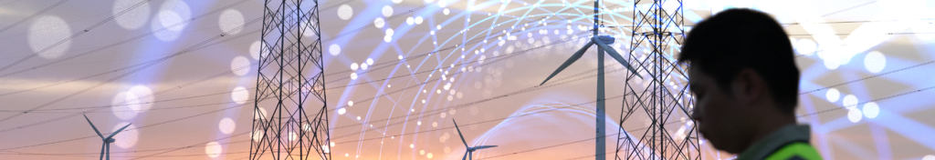 Silhouette of a worker near wind turbines and power lines with digital network graphics in the background.