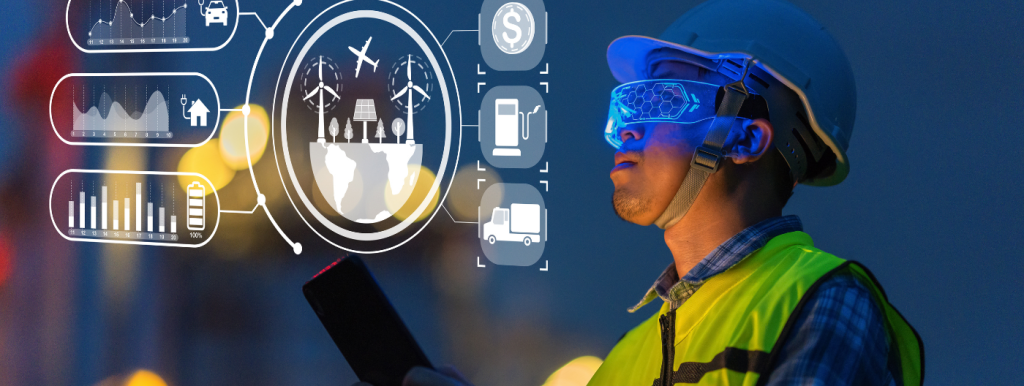 A construction worker wearing a helmet and smart glasses holds a tablet. Holographic digital icons show global data, charts, energy, transportation, and currency, suggesting the use of advanced technology in industrial or energy sectors.