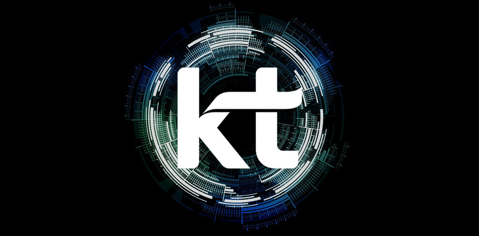A bold, white "kt" logo is centered on a dark background. Surrounding it is a circular digital design with varying shades of blue and green, resembling technological circuits or data patterns. The design gives a futuristic and high-tech impression.