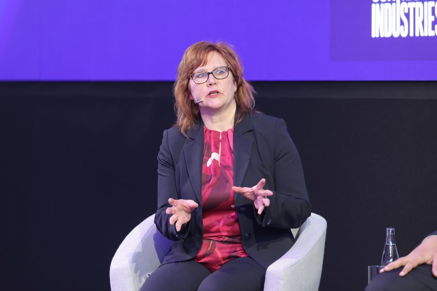 A person with red hair and glasses is MWC25 Sports and Entertainment Summit