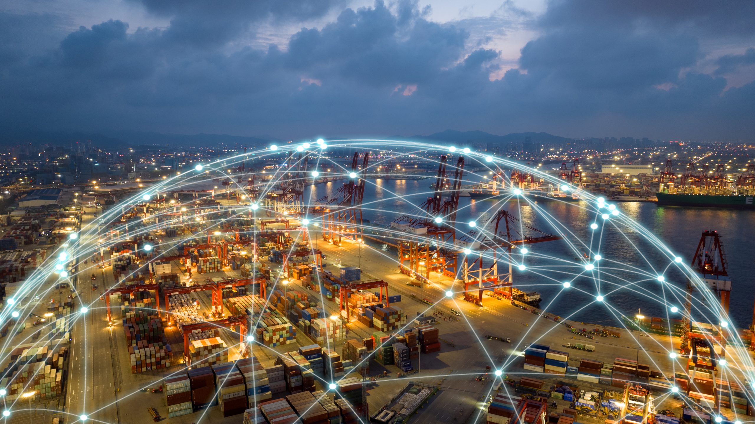 Aerial view of a busy port at dusk with digital connection lines symbolising global connectivity.
