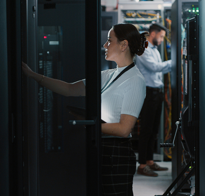 Women and man in IT data centre