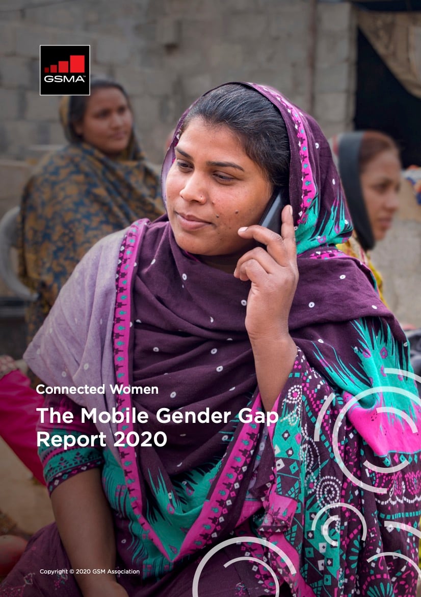 A woman in a colourful purple and teal patterned shawl smiles whilst talking on a mobile phone. She is seated outdoors with other women in the background. Text on the image reads: "Connected Women The Mobile Gender Gap Report 2020.