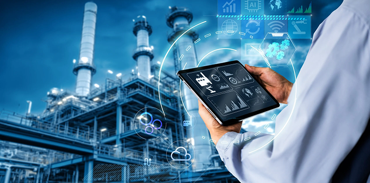 A person in a white shirt holds a tablet showing industrial data, graphs, and icons. In the background is a large industrial plant with towers and pipes. Digital graphics and technology icons are overlaid, illustrating smart industry concepts.